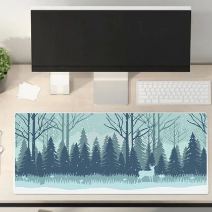 Mockup of a desk mat illustration, white and blue colours of a snow landscape, trees and mountains. Deer is in foreground.